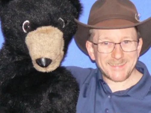 Kevin Pittman with a bear puppet