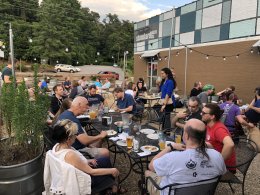 Camp attendees enjoying pizza, beverages, and good conversation.